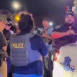 A phalanx of federal and local police arrest a man for smoking weed in public on U Street. (Source)