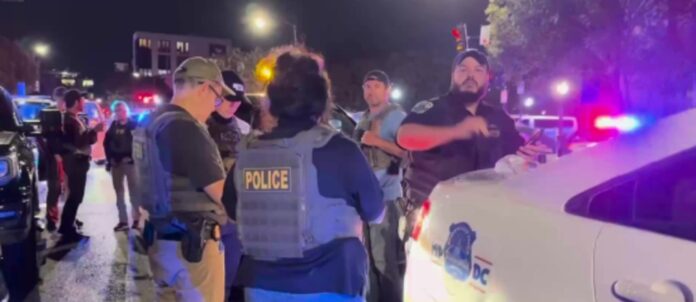A phalanx of federal and local police arrest a man for smoking weed in public on U Street. (Source)