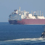 Tanker and destroyer in Strait of Hormuz