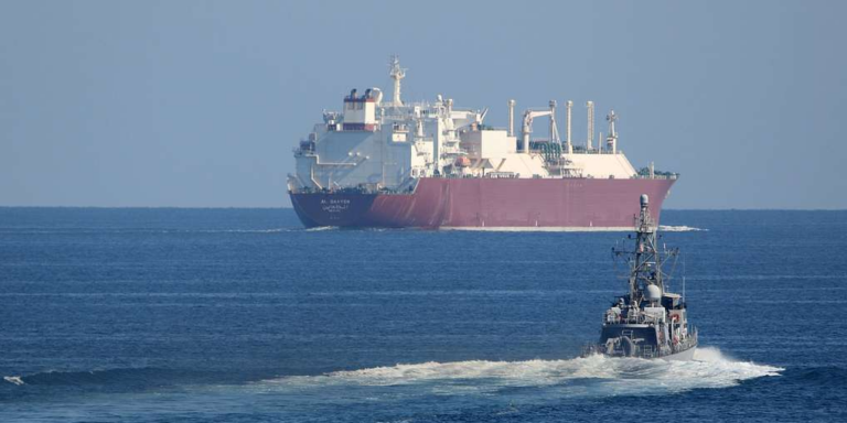 Tanker and destroyer in Strait of Hormuz